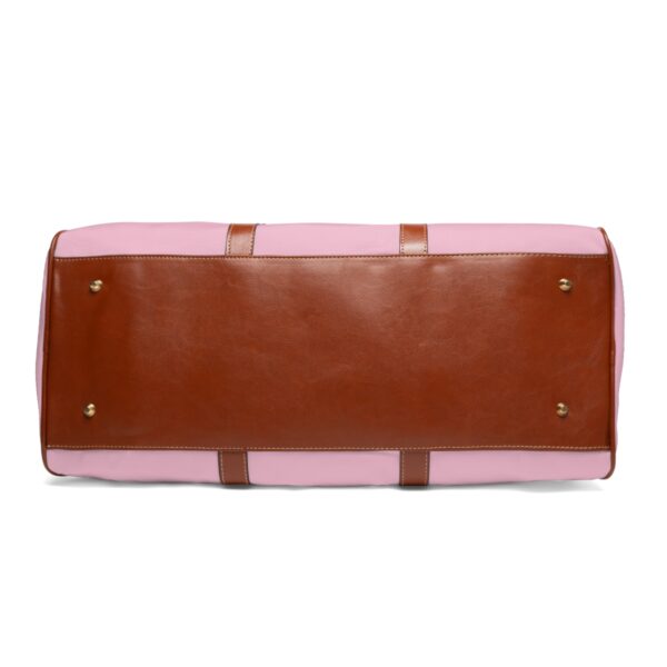 faded pink and black travel bag