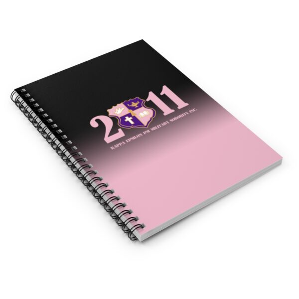 faded pink and black spiral notebook ruled line