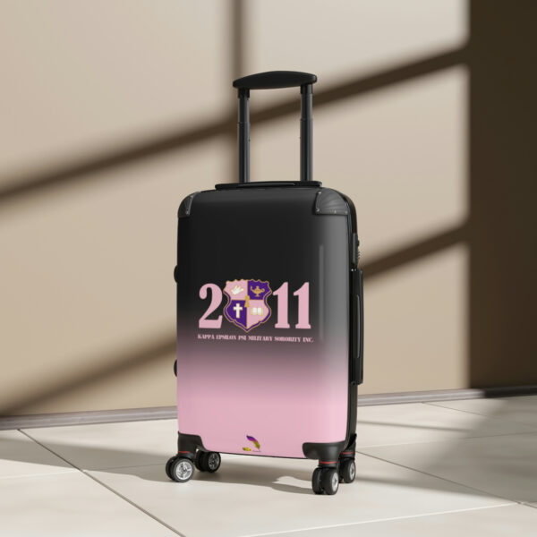 faded pink and black suitcases