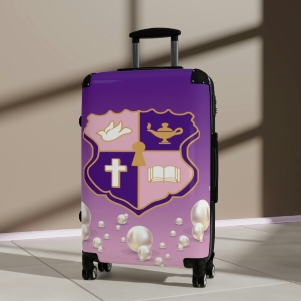 faded pink and purple k.e.Ψ. suitcases