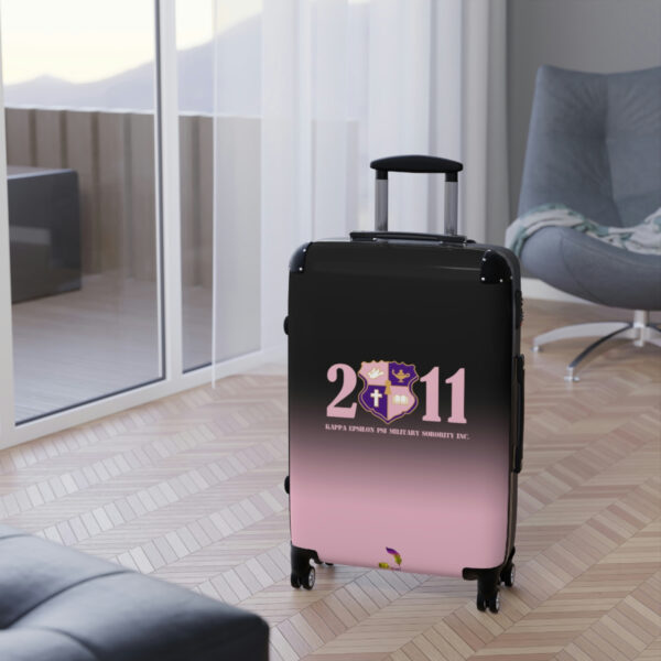 faded pink and black suitcases