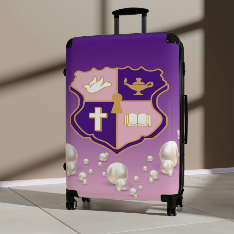 faded pink and purple k.e.Ψ. suitcases