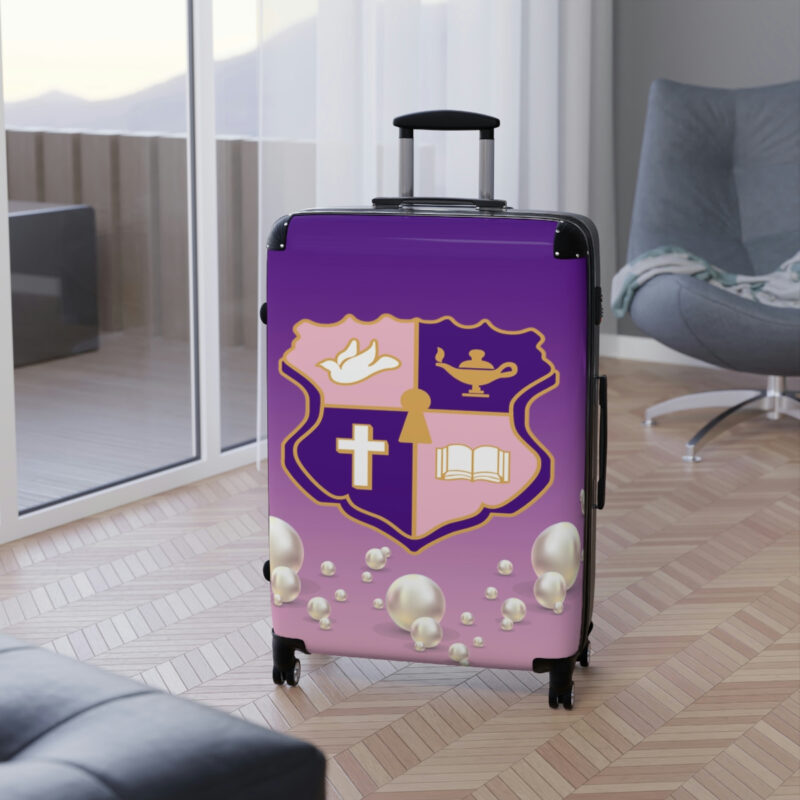 faded pink and purple k.e.Ψ. suitcases