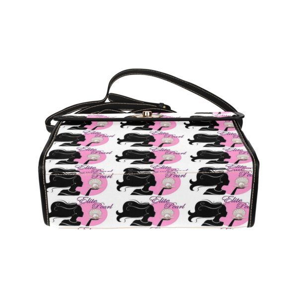 Designer patterned handbag with black and pink print.