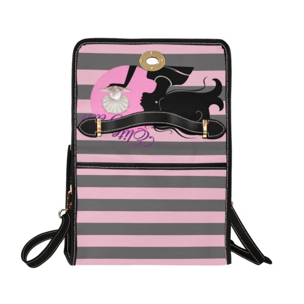 Striped crossbody bag with stylized cat design