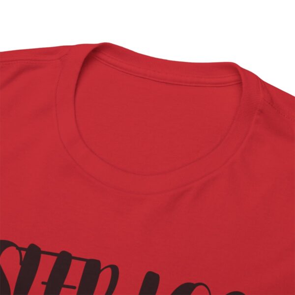 Red t-shirt with partial black text design.