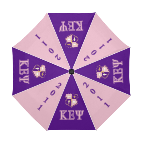 Purple and pink umbrella with key emblem.