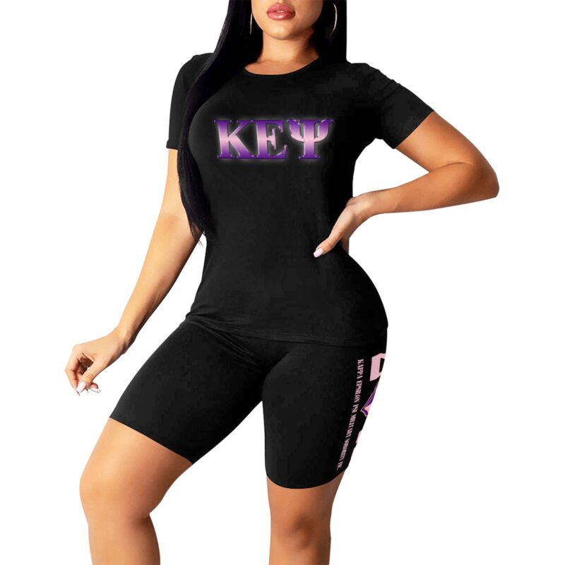 Woman in black sportswear with branded design.